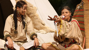 Devin and Klara - Luscious vixens Devin, darker hair, and Klara, brown hair, sit outside the teepee smoking a peace pipe, then they strip off their Indian costumes to fondle and suck each other&#039;s firm tits and perky nipples. Devin goes down on a spre