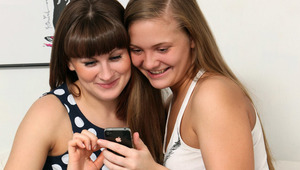 Anise and Rana - Anise (darker hair) and Rana are playing a game on Anise&#039;s phone. The girls lose interest in the game and start kissing, and they suck each others nipples as they undress each other. Then Rana sits on Anise&#039;s face, and then they